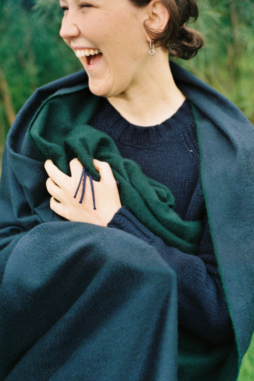 ALT=Full of joy, wrapped in a cashmere reversible throw by Begg X Co.