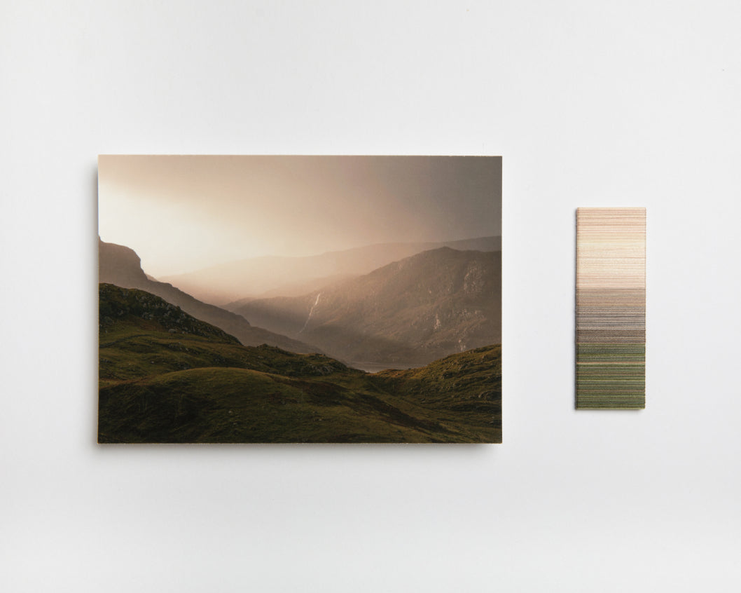 Glencoul, captured at dawn by photographer Richard Gaston. Thread wrap by Lauren Day. The starting point for Jennifer's blanket. ALT=Thread wrap by colourist Lauren Day and photograph by Richard Gaston. The starting point of Jennifer Kent's blankets.