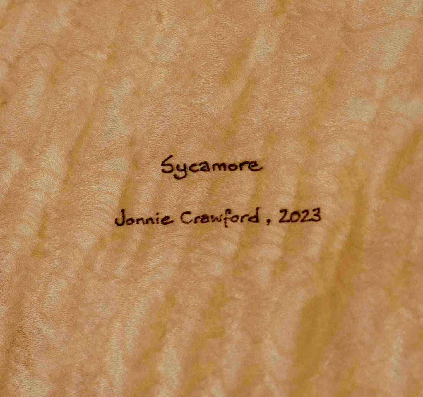 ALT=Jonnie Crawford's maker's mark on the reverse of the Rippled Sycamore bowl.