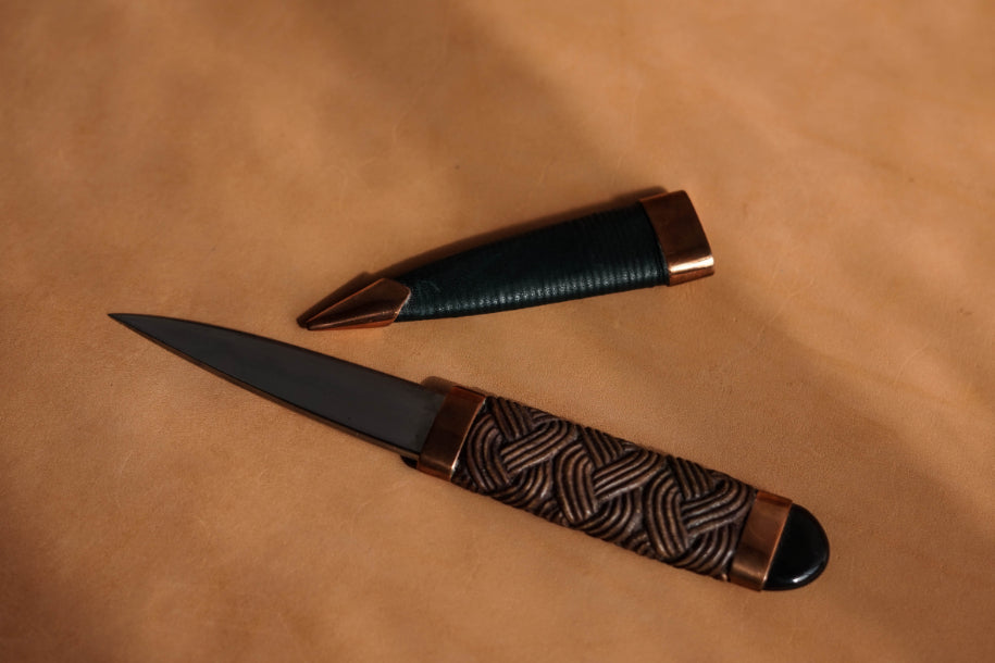 ALT=Walnut Sgian Dubh from Skye Knives. Forged and handmade by Jake Clelland.