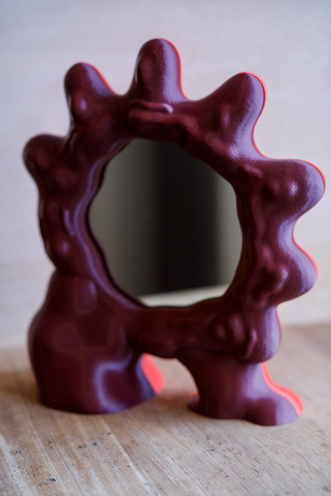 ALT=Deep red 3D printed mirror by Wobbly Digital Studio. Made in Glasgow.