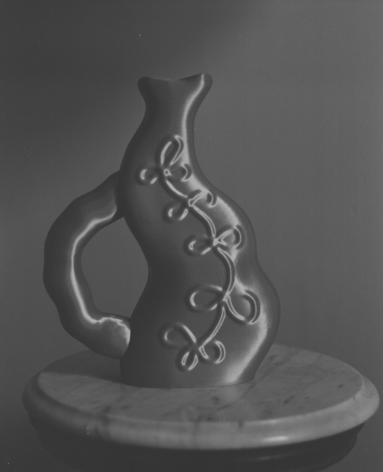 ALT=Grayscale image of the Vine Vase by Wobbly Digital Studio.