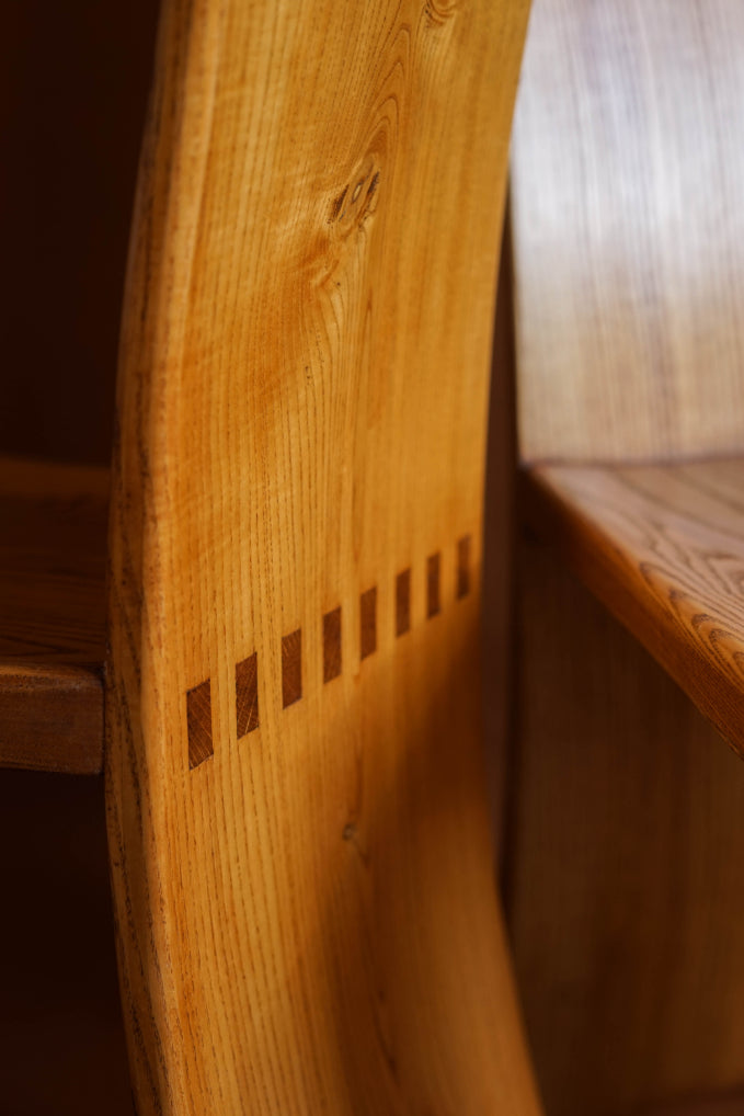 ALT=High Backed Elm chair. Likely made in Glasgow in the 1970s and inspired by Charles Rennie Mackintosh.