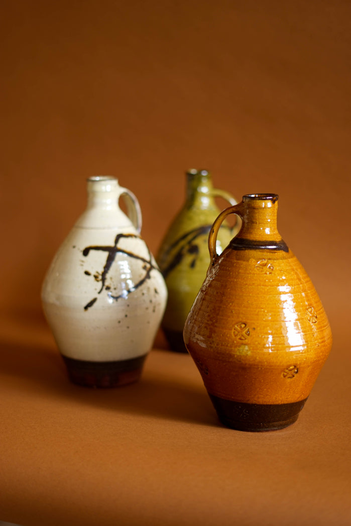 ALT=Earthenware flagons by Dumfries and Galloway-based studio potter Joshua Williams. Shown here in three colours of glaze.