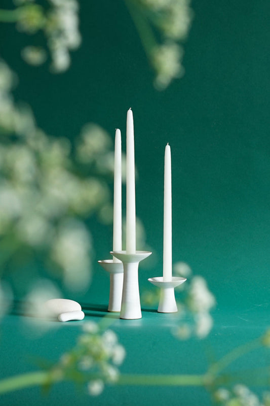 ALT=Three sizes of the Midsummer candlesticks by Cara Guthrie. Shot through cow parsley at Bard Scotland in Leith.