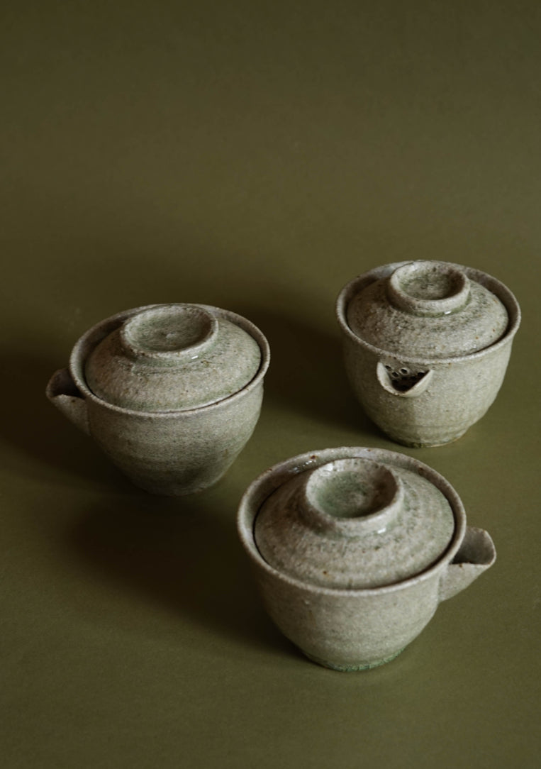 ALT=Three Gaiwan ash glazed teapots by Jonathan Wade. The hand poked cermamic mesh can be seen. Keeping loose tea leaves at bay.