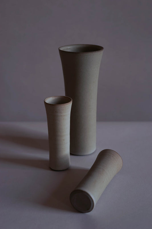 ALT=Small and large vases by Jono & Emily. In white and Bard Grey.