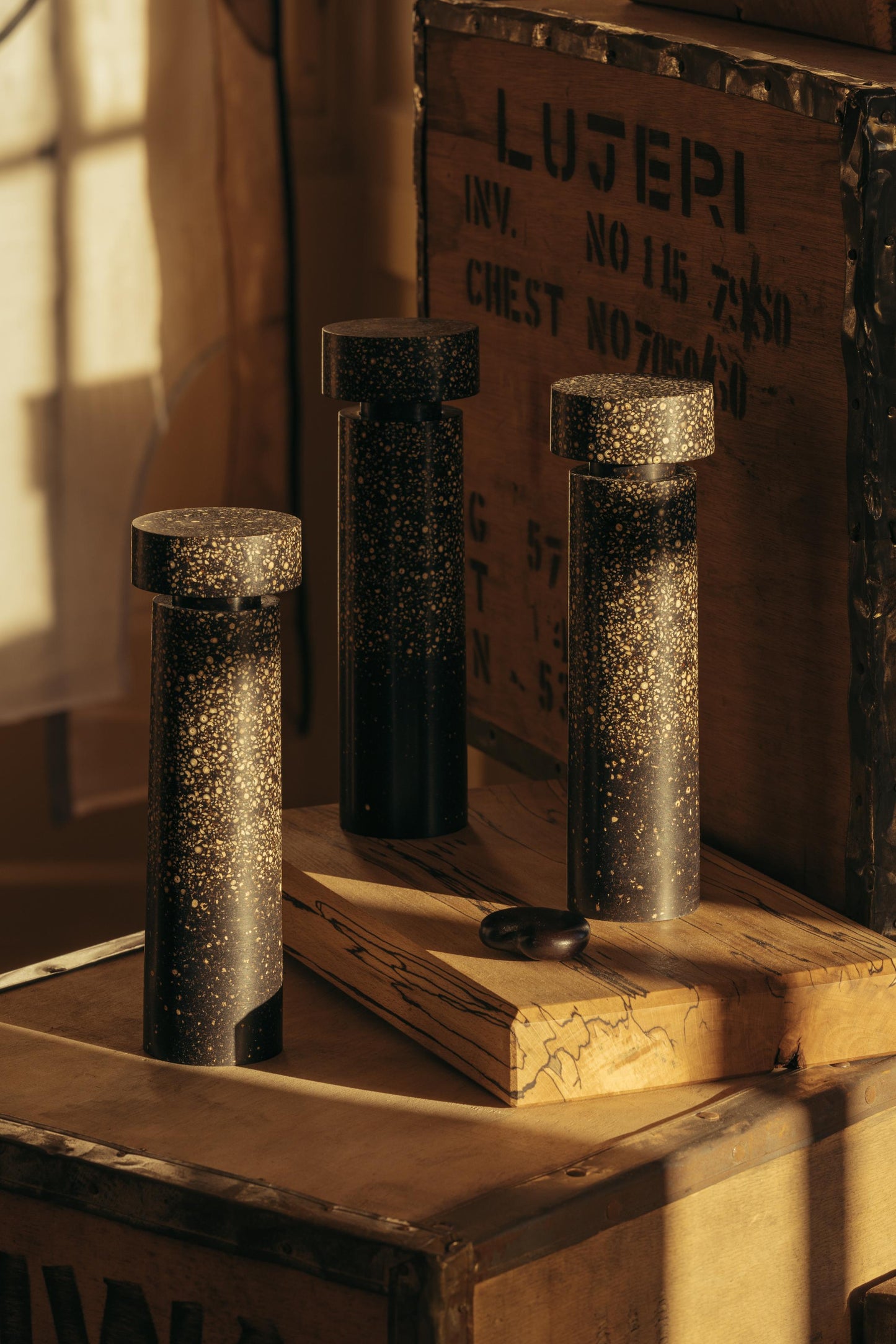 ALT= Three Pepper Pepper Mills by Marc Sweeney. Drenched in sunlight at Bard Scotland in Leith. 