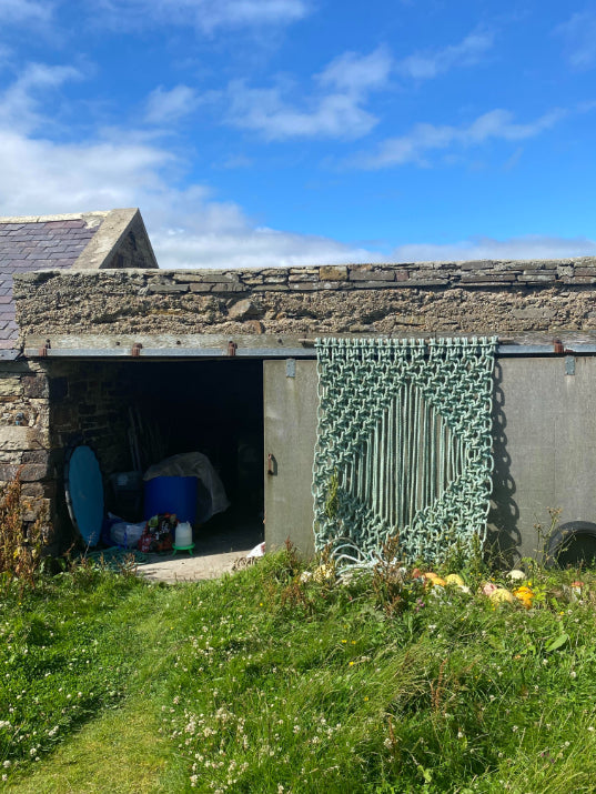 ALT=Sea rope hanging by A Frayed Knot. Hung at its birthplace in Orkney.