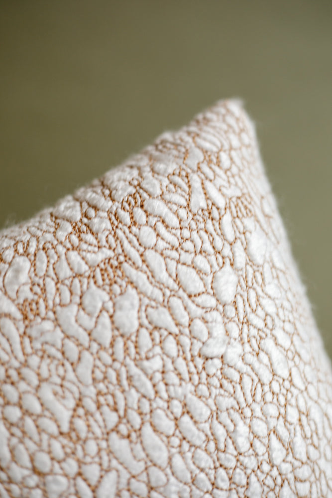 ALT=The point of a seaweed cushion. Showing the gold bamboo silk thread embroidery. 